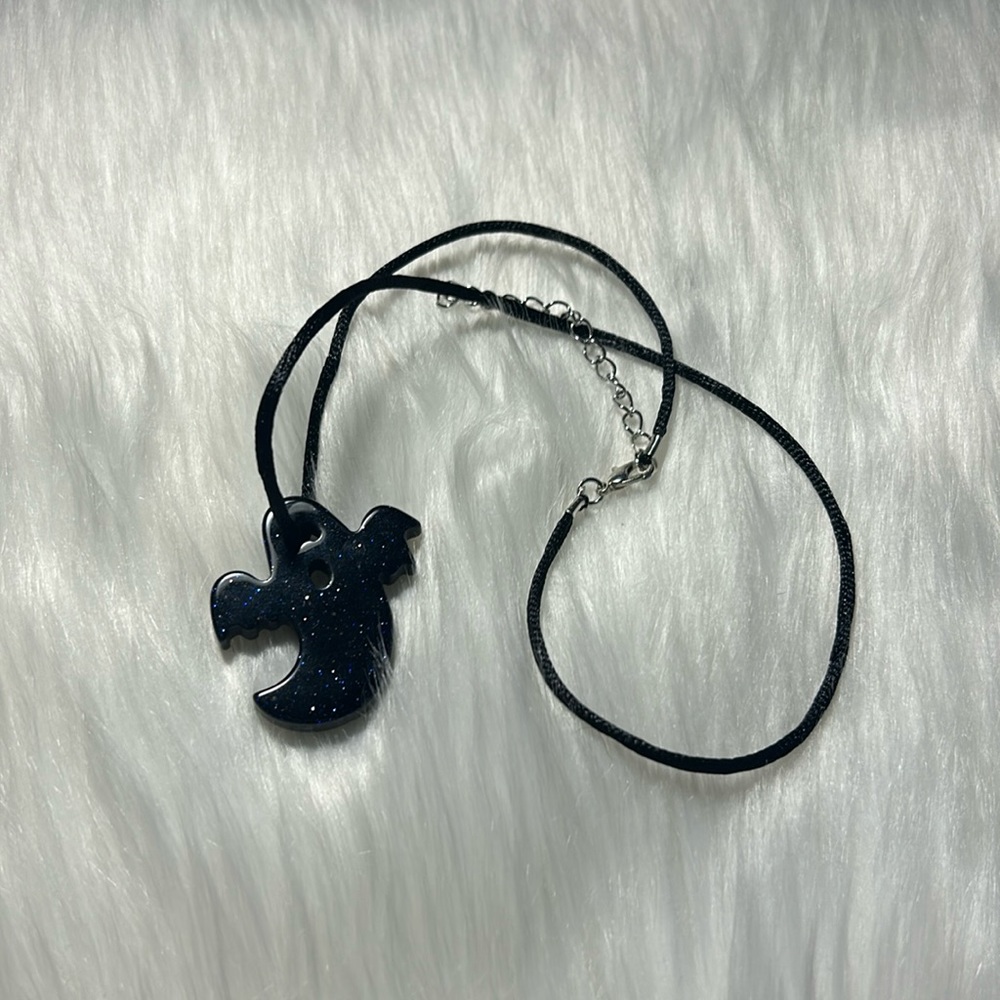 Obsidian ghost pendant on rope necklace